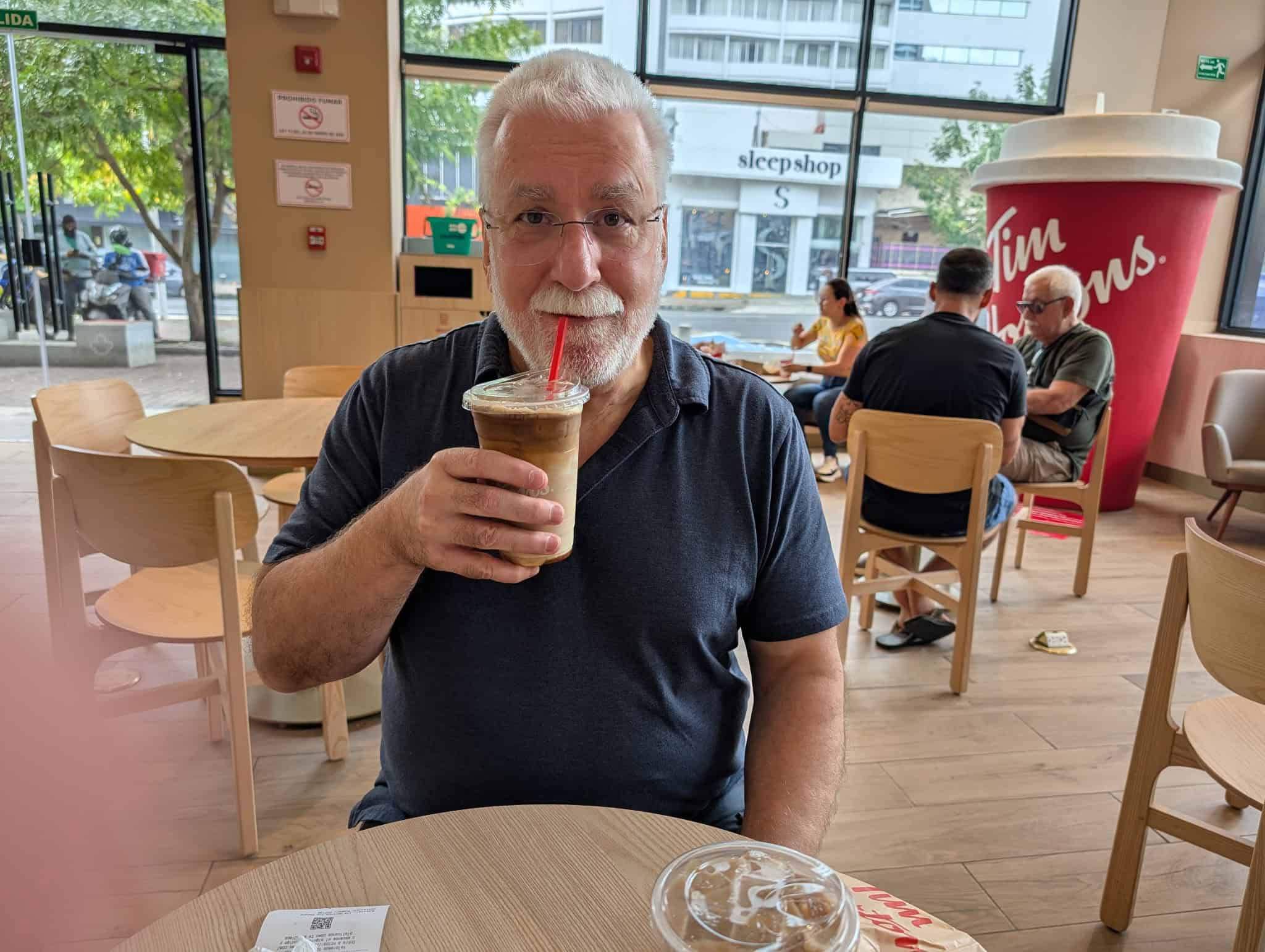 Brian at Tim Hortons in Panama City with iced French Vanilla coffees