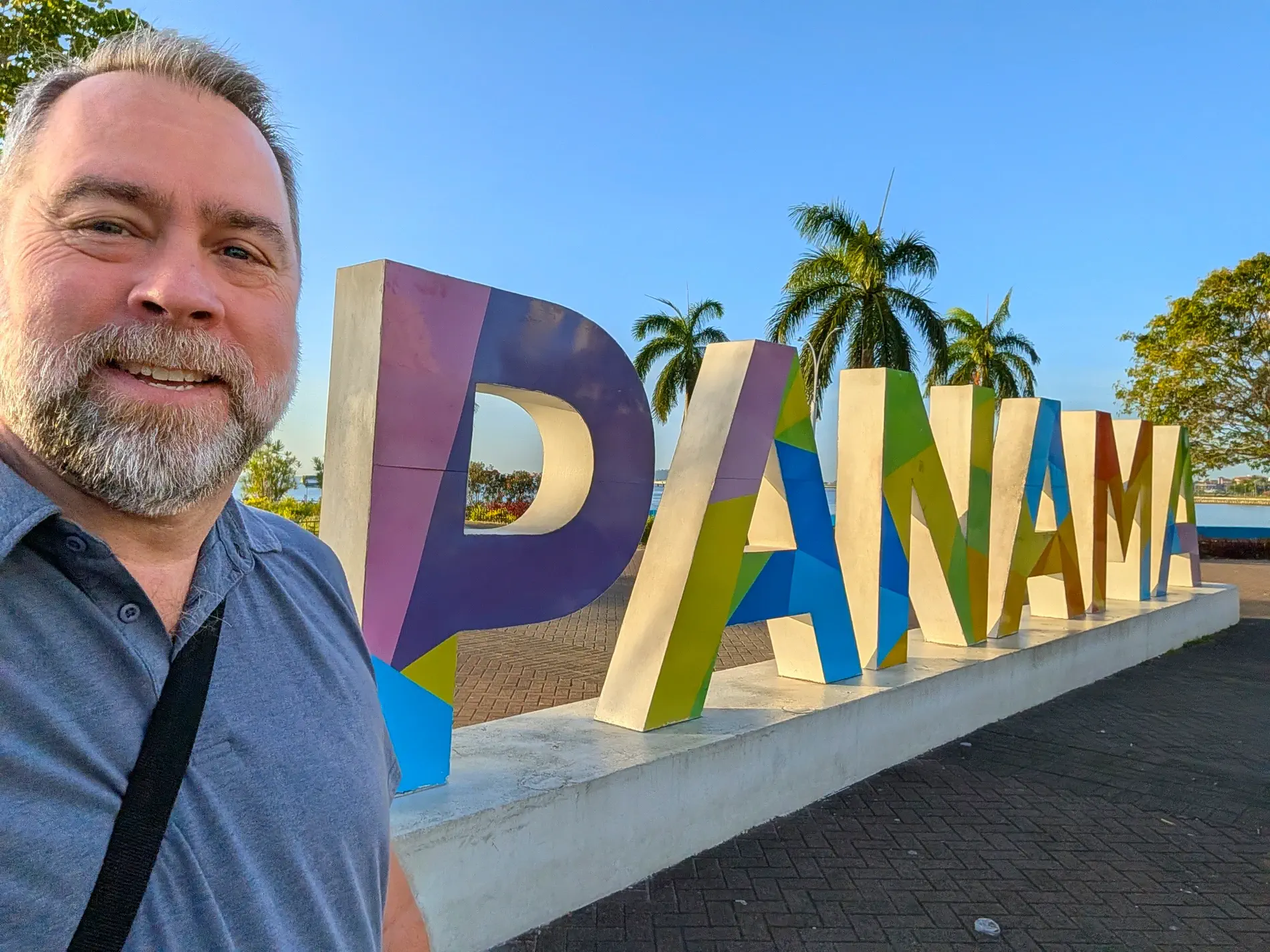Kent standing in front of the Panama sign on the Cinta Costera waterfront